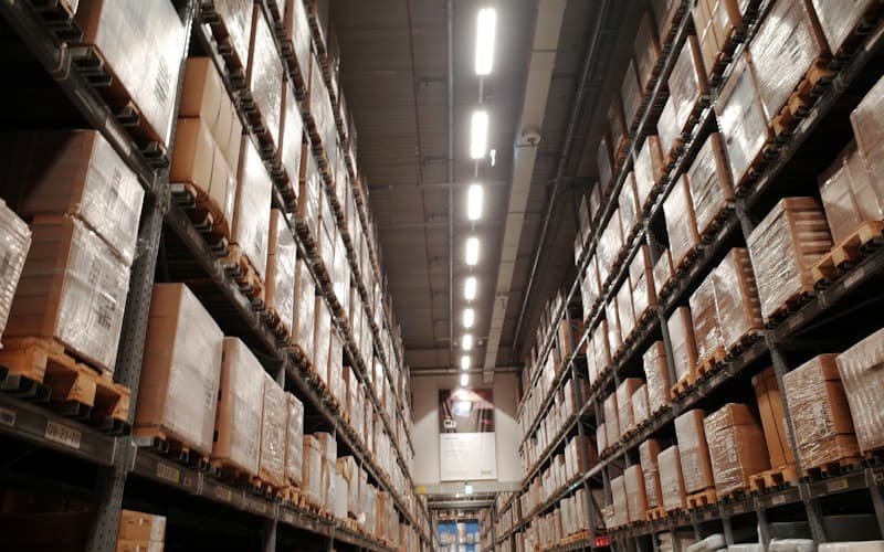 Warehouse aisles with stocked distribution shelves